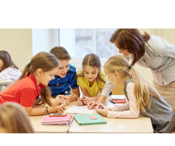 Teacher working with a group of primary school children